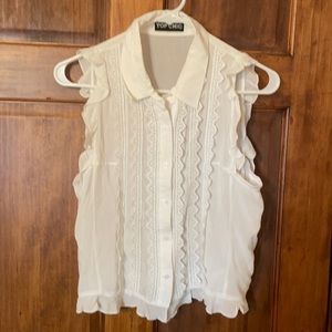 Size L- White, button down, sleeveless, ruffled blouse.